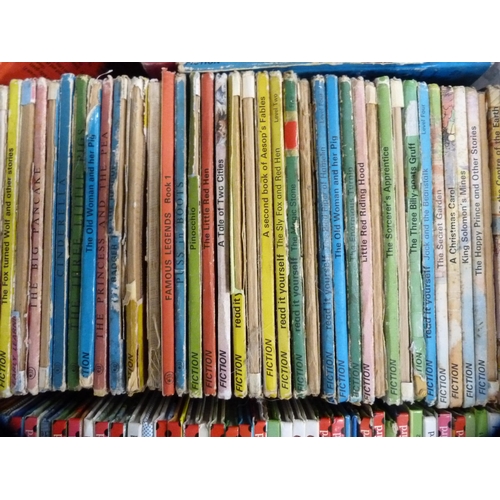 143 - Three cartons containing a large quantity of Ladybird books, various titles.