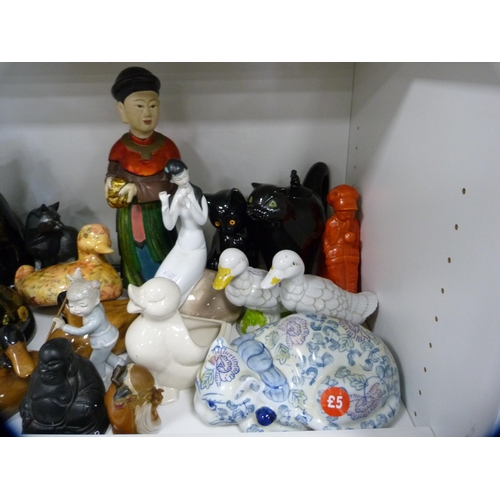 154 - Assorted ceramic and other figures to include Buddha, cats, ducks, sage etc (one shelf).