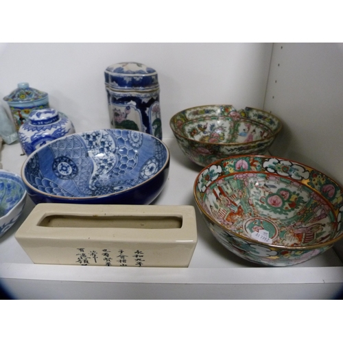 164 - Canton famille rose bowls, blue and white carpet-style bowls, vases and covers, dolls, Buddha figure... 