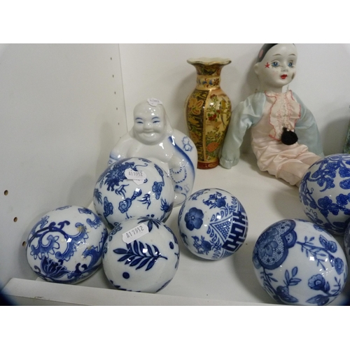 164 - Canton famille rose bowls, blue and white carpet-style bowls, vases and covers, dolls, Buddha figure... 