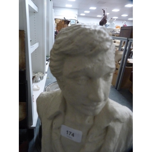 174 - Plaster figure of a male on a naturalistic setting.