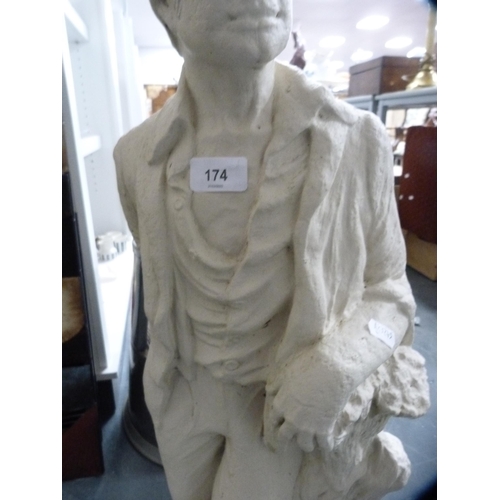 174 - Plaster figure of a male on a naturalistic setting.