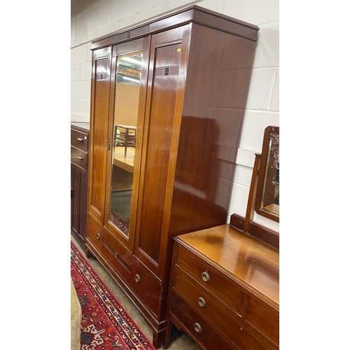 517 - 1930s mahogany bedroom suite comprising wardrobe; mirror back dressing chest and wash stand