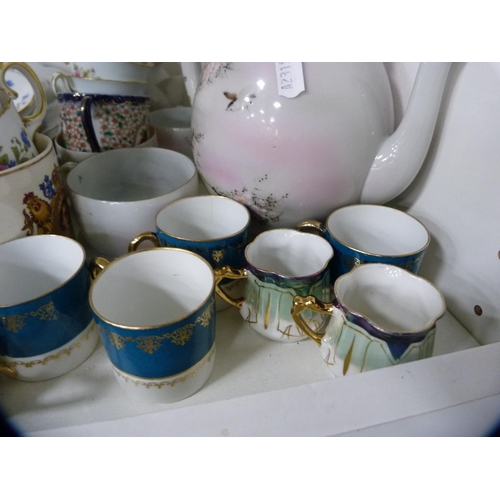 184 - Assorted porcelain tea and coffee wares to include Vienna-style, Minton, eggshell, also a gurgle jug... 