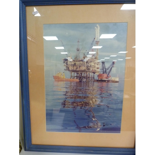 221 - Photograph of an oil rig, eastern picture, brass-framed wall mirror and an unframed circular wall mi... 