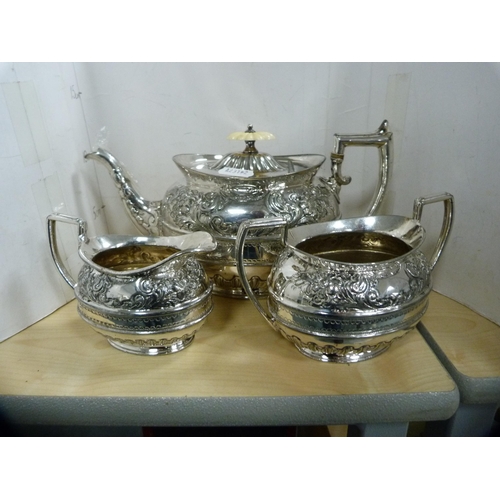 234 - Antique three-piece embossed EP tea set and a spirit kettle on stand.