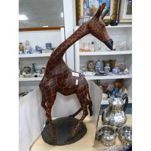 244 - Contemporary wooden figure of a giraffe and a contemporary metal figure of a cat.  (2)