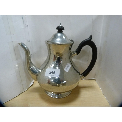 246 - Liberty & Co., three-piece hammered pewter tea set, no. 01075.