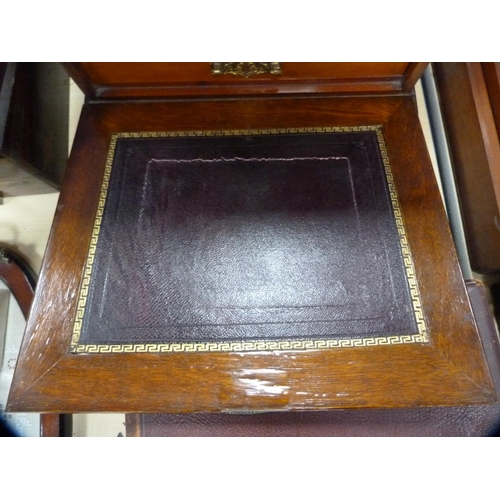 25 - Edwardian writing cabinet with fall front and tooled panel.