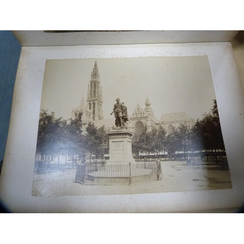 26 - Tooled leather photograph album enclosing vintage tourist photographs including Canada, Cologne and ... 