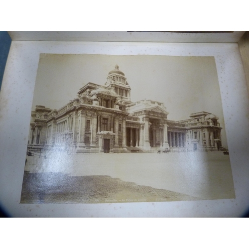 26 - Tooled leather photograph album enclosing vintage tourist photographs including Canada, Cologne and ... 