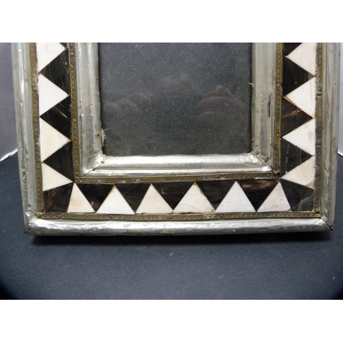 268 - White metal, ebony and bone decorated photograph frame.