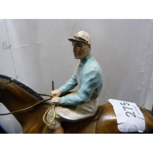 275 - Cold painted table lighter modelled as a horse and jockey on a plinth stand.