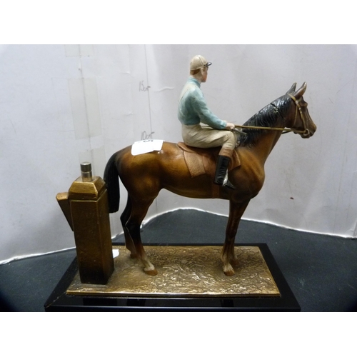 275 - Cold painted table lighter modelled as a horse and jockey on a plinth stand.