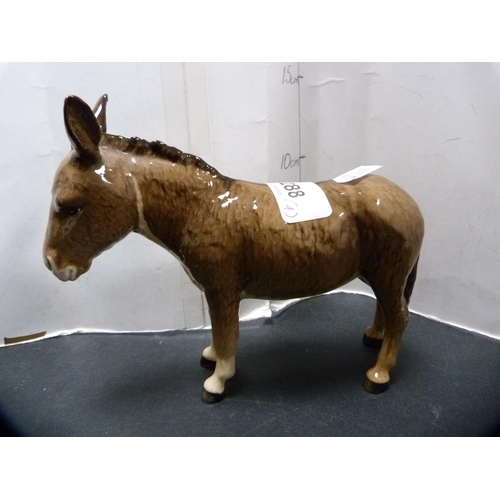 288 - Beswick figure of a donkey and three Beswick foals.  (4)