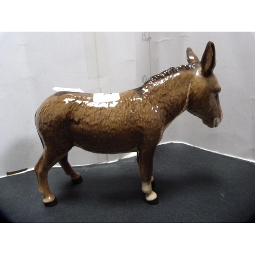 288 - Beswick figure of a donkey and three Beswick foals.  (4)