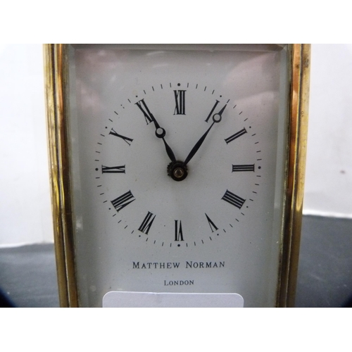 291 - Brass four glass carriage clock retailed by Matthew Norman, London, with key.