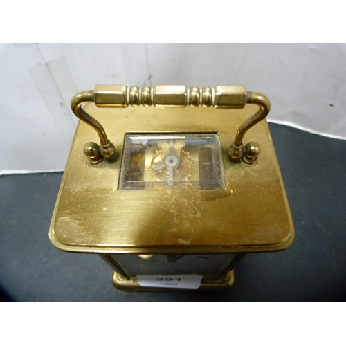 291 - Brass four glass carriage clock retailed by Matthew Norman, London, with key.