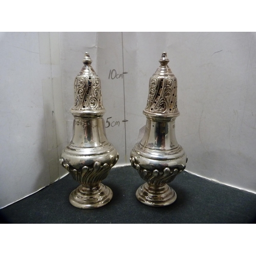 292 - Pair of silver pepper pots, hallmarks for Sheffield, 146.7g gross, and a silver-mounted desk calenda... 