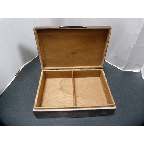 296 - Silver cigarette box with cedar-lined interior.