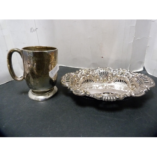 297 - Silver christening tankard, 86.3g, also a pierced and embossed bon-bon dish and two silver-backed br... 