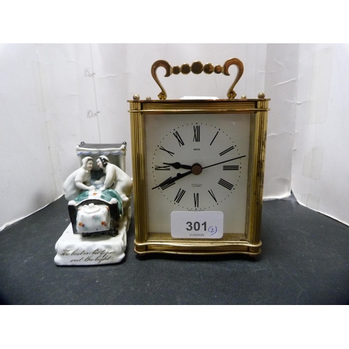 301 - Smith's electronic carriage clock and a porcelain bookend modelled as a nurse at a hospital bed.&nbs... 