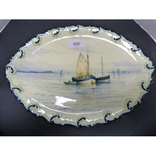 302 - Royal Crown Derby oval dish decorated with fishing boats at sea.