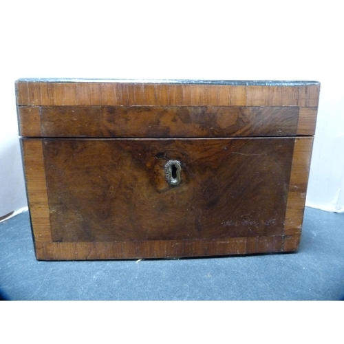 304 - George III walnut crossbanded tea caddy with twin compartments.