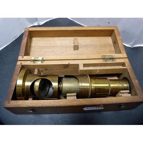 305 - Gilt metal lens, cased.