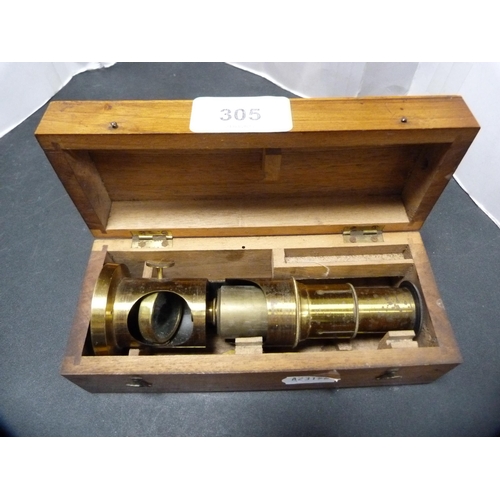 305 - Gilt metal lens, cased.