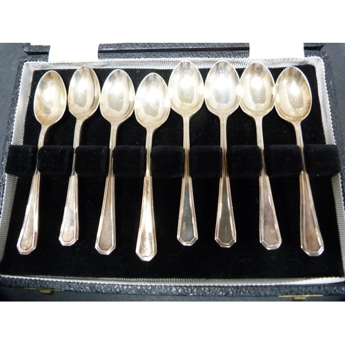 309 - Set of eight silver coffee spoons, cased.