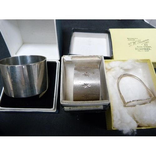 310 - Three assorted silver napkin rings, all cased, 92.3g.