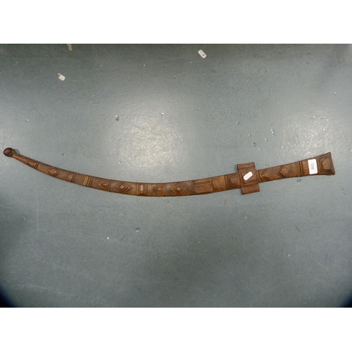 336 - Middle eastern sword fixed to a tooled leather scabbard.