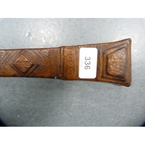 336 - Middle eastern sword fixed to a tooled leather scabbard.