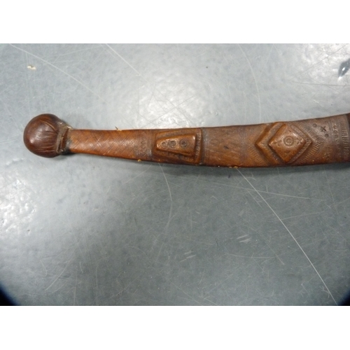 336 - Middle eastern sword fixed to a tooled leather scabbard.