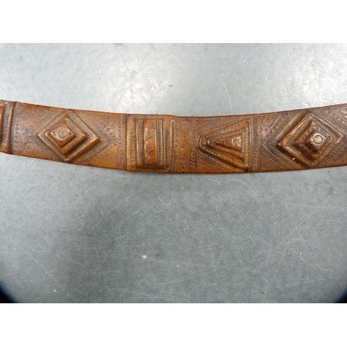 336 - Middle eastern sword fixed to a tooled leather scabbard.