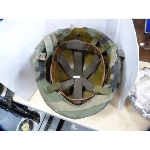 34 - USA ground troop's (Type 1) military helmet with camouflage cover.