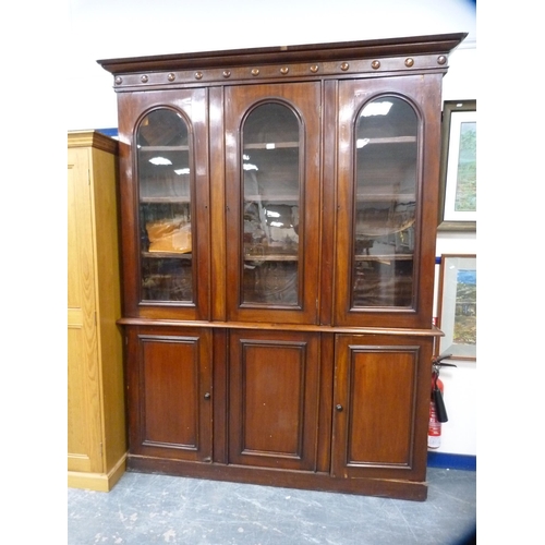 357 - Victorian mahogany library bookcase with Gothic-influenced roundels to the shaped cornice above thre... 