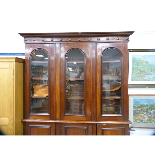 357 - Victorian mahogany library bookcase with Gothic-influenced roundels to the shaped cornice above thre... 