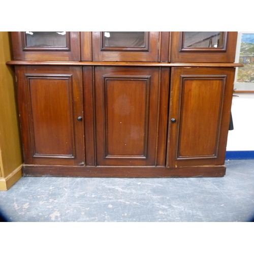 357 - Victorian mahogany library bookcase with Gothic-influenced roundels to the shaped cornice above thre... 