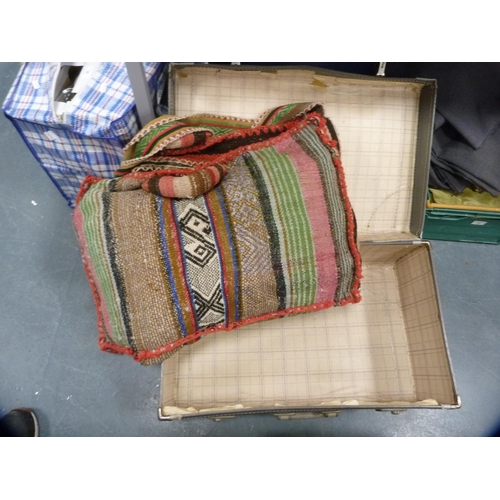 36 - Carton containing a pair of velour curtains, cut-out fabric, a patchwork throw and a suitcase.