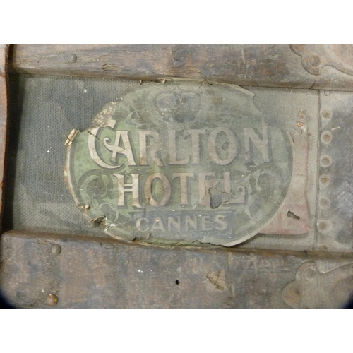 4 - Wood-bound travel trunk containing a Gladstone bag.