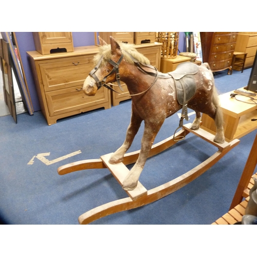 42 - Large plaster rocking horse on a wooden cradle support.