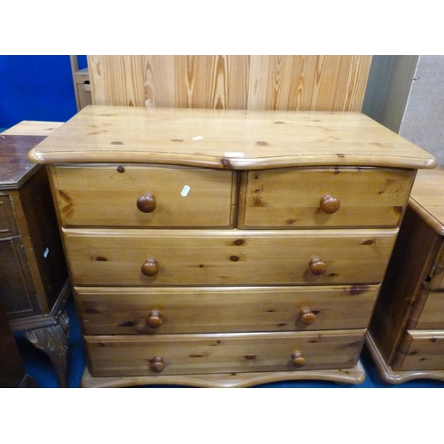 504 - Modern pine serpentine chest of two short and three long drawers and a matching three-drawer bedside... 