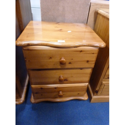 504 - Modern pine serpentine chest of two short and three long drawers and a matching three-drawer bedside... 