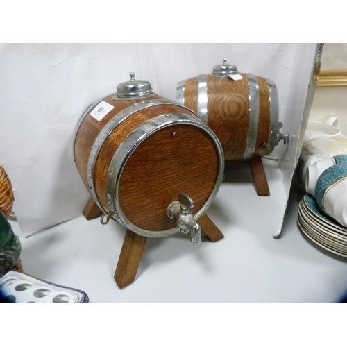 68 - Pair of oak and metal-bound spirit barrels with tap dispensers.  (2)