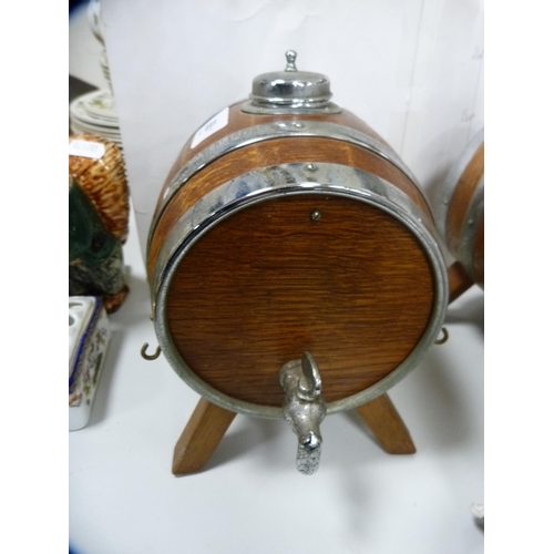 68 - Pair of oak and metal-bound spirit barrels with tap dispensers.  (2)