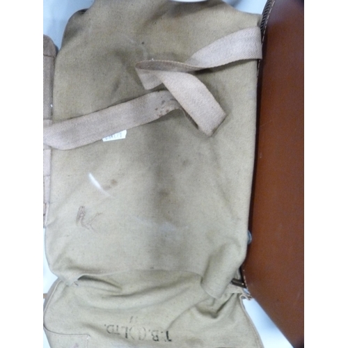 82 - WWII period Norman gas mask contained in a khaki canvas carry bag.