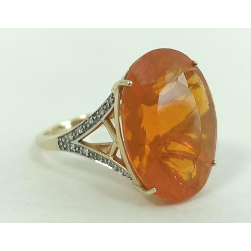 170G - Fire opal ring, 19mm x 15mm, with diamond set shoulders, in 9ct gold, size 'N'.