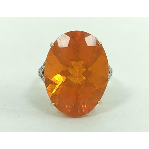 170G - Fire opal ring, 19mm x 15mm, with diamond set shoulders, in 9ct gold, size 'N'.